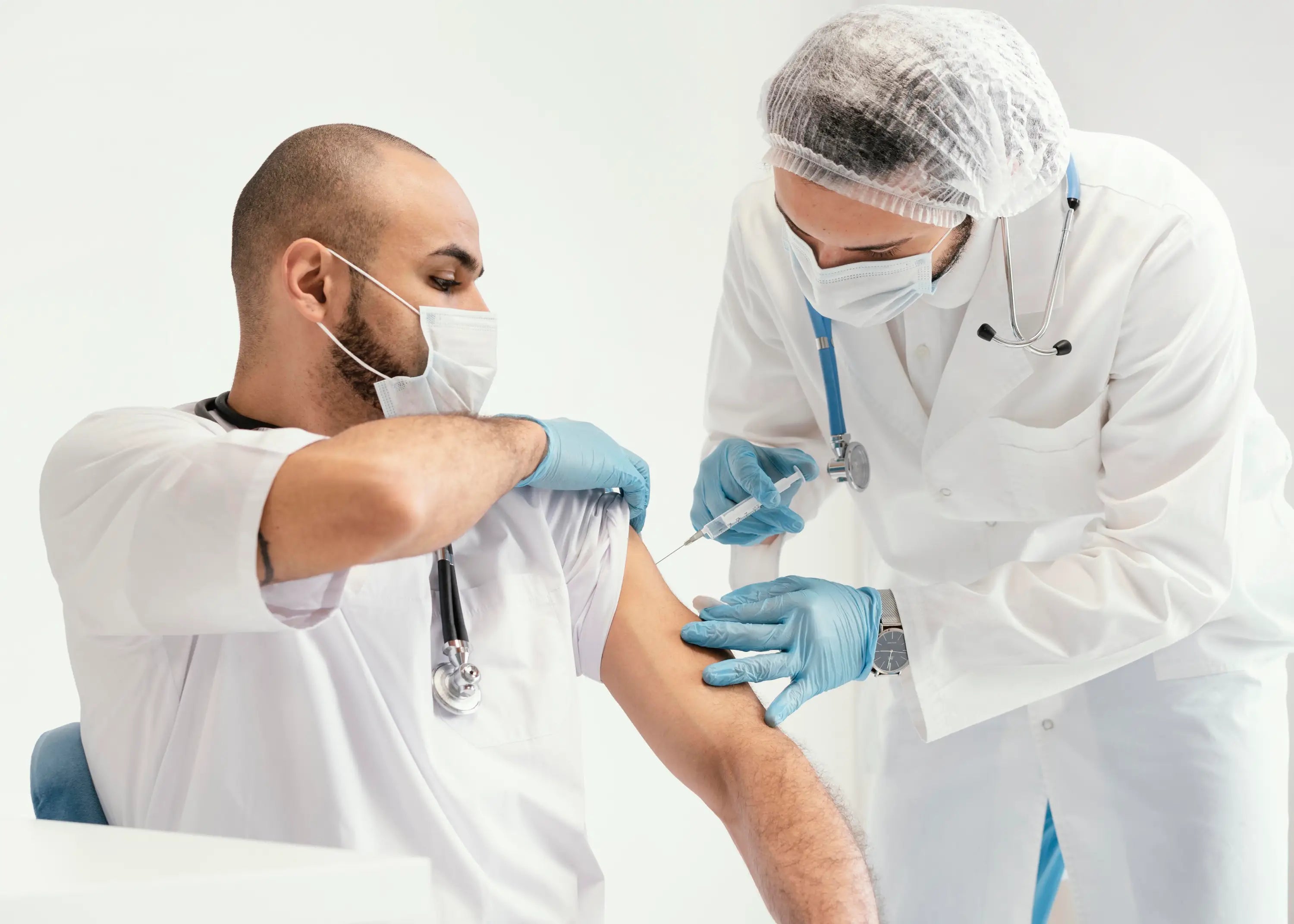 Doctor administering a vaccine to a patient in a clinical setting