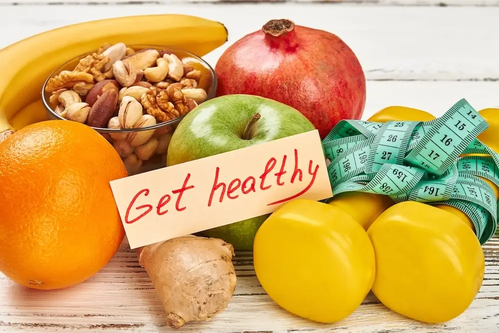 Healthy fruits, nuts, and a measuring tape with a note saying 'Get Healthy,' promoting a nutritious lifestyle